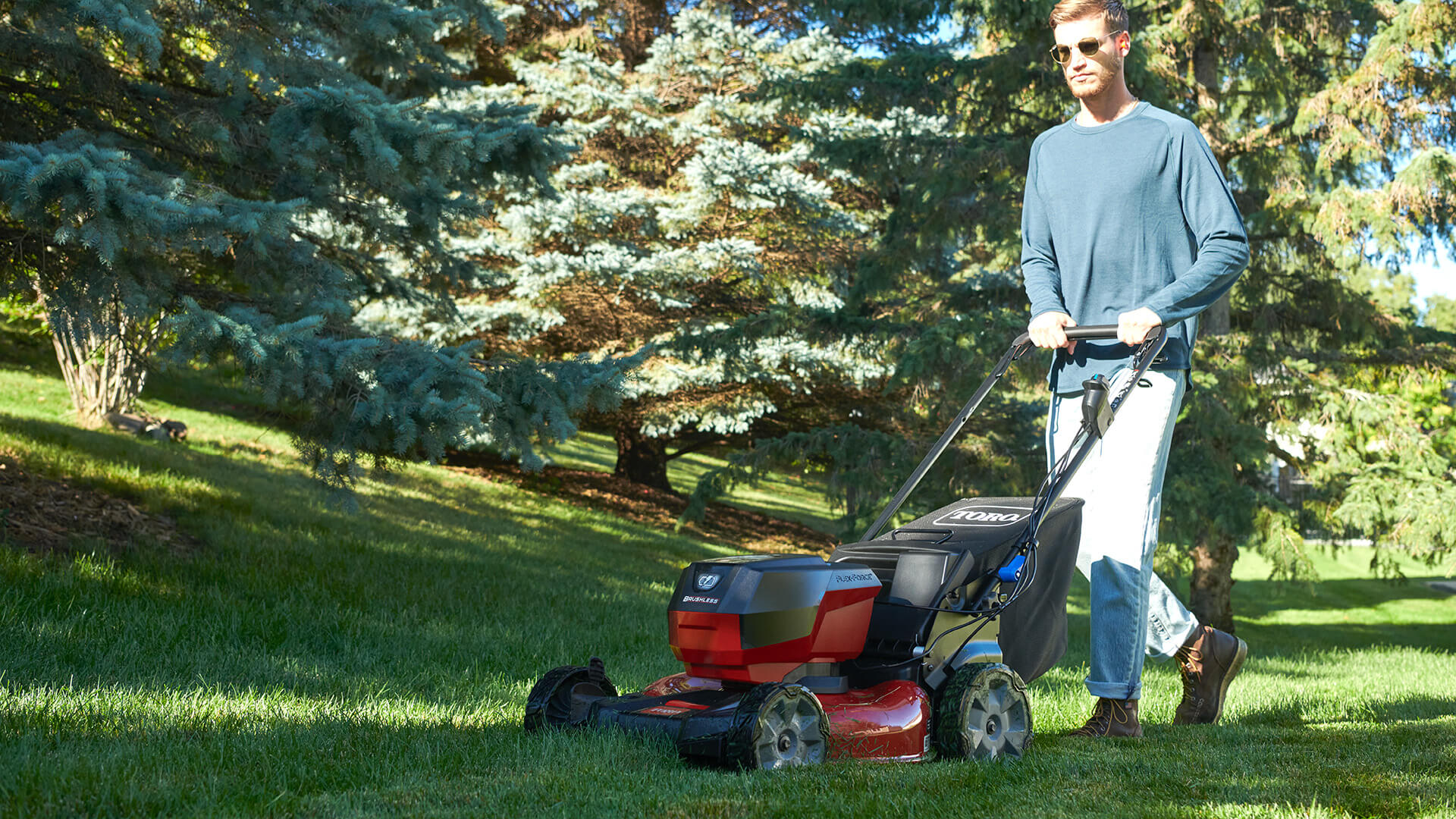 man mowing yard with Toro 60V Max* 21” Recycler® Mower